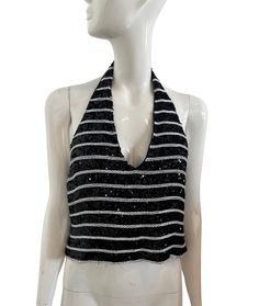 Ungaro Y2K halter top in black and white sequins in a striped pattern. Lined in silk. Excellent condition with no missing sequins.  Size 8 or EU42 Chest 33" Length 19.5" Waist 30" Spring Sequined Halter Neck Top, Sequined Spring Halter Top, Sequin Halter Neck Top For Spring, Summer Sequin Halter Neck Top, Summer Halter Neck Top With Sequins, Sequin Halter Neck Top For Summer, Embellished Halter Neck Top For Spring, Spring Sequined Halter Top For Night Out, Sequin Halter Top For Spring Night Out