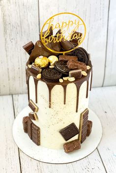 a birthday cake decorated with chocolate and cookies