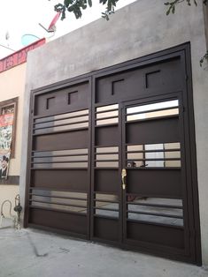 an image of a garage door that is brown and has metal bars on the side