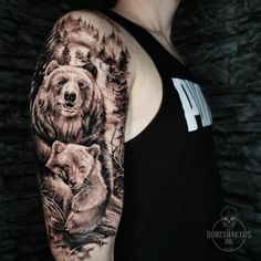 a man with a bear and cub tattoo on his arm