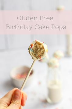 a hand holding a birthday cake pops with sprinkles on it and the text gluten free birthday cake pops