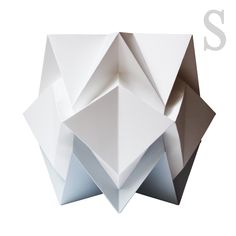 an origami sculpture is shown with the letter s on it's side