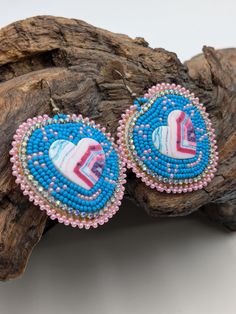 Beautifully hand beaded, turquoise colored, heart shaped, 2-inch-wide earrings with hypoallergenic hooks. Genuine leather backing.  These come gift-ready in carboard Kraft jewelry box with descriptive card as shown. These earrings were Beaded for Creator's Place by a Pine Point tribal artisan of the White Earth Nation in Northern Minnesota. Handmade Southwestern Beaded Earrings For Gifts, Handmade Heart Earrings With Round Beads For Gift, Handmade Heart Earrings As Gift, Handmade Multicolor Jewelry For Valentine's Day, Blue Heart Beads Jewelry For Festivals, Traditional Handmade Heart Jewelry, Handmade Adjustable Drop Heart Earrings, Unique Handmade Heart Earrings, Bohemian Beaded Jewelry For Valentine's Day