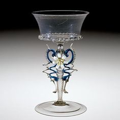 a glass vase with an intricate design on it