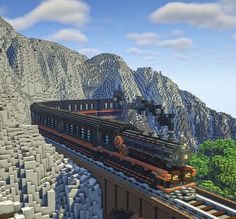 an image of a train going over a bridge in minecraft with mountains and trees