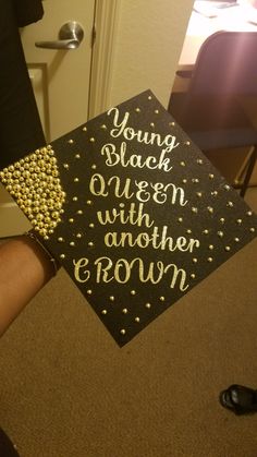 a graduation cap that says young black queen with another crown