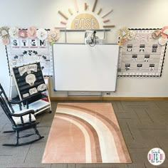 a room with two rocking chairs and a white board