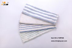 four white and blue towels stacked on top of each other