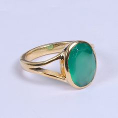 Handcrafted 18k gold-plated statement rings for women are made with natural green onyx gemstone.  A design that is both timeless and affordable. Created by Bhagat Jewels, all our genuine gemstone jewelry is customizable and handmade in Jaipur, India.  Artisan Made Ring, Natural Green Onyx Ring, May Birthstone Ring, Designer Ring, Statement Ring, Birthday Gift Ring, Beautiful Unisex Ring Product Details Item Code: BJBR-2082 Stone Name: Green Onyx Stone Shape: Oval Stone Size: 10*14mm Metal: 18K Y Gold Oval Chrysoprase Emerald Ring, Green Onyx Emerald Ring, Elegant Green Chalcedony Rings, Polished Chrysoprase Ring Suitable For Gift, Gold Formal Emerald Ring With Chrysoprase, Formal Gold Emerald Chrysoprase Ring, Green Onyx Gemstone Rings As Gift, Oval Green Onyx Gemstone Ring, Gold Chrysoprase Rings For Anniversary