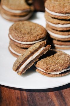 several cookies are stacked up on a white plate