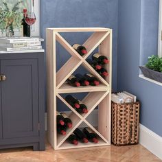 a wooden wine rack sitting next to a window