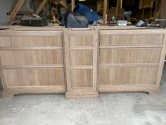 two wooden dressers sitting next to each other in a room filled with wood furniture