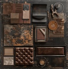 an assortment of furniture and accessories arranged on a black surface with rusted metal accents