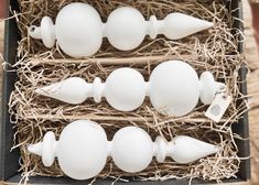 an assortment of white eggs in a box