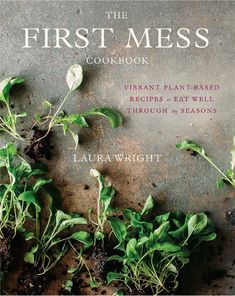 the first mess cookbook is shown with plants growing out of it and dirt on the ground