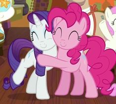 two pinkie ponies hugging each other on the floor