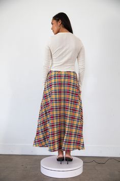 Our ankle length dream skirt is made with over 2 yards of midweight, breathable 100% woven cotton creating a flowing drape and flattering silhouette on every body. It has an elastic waistband, finished hemline, and pockets at either side seam. This skirt is truly so gorgeous and perfect in every way. It is designed to be worn at the waist but can be worn at the hips for a baggy look. Dress up or down with one of our scoop back camis, or matching babydoll tops. A-line maxi skirt Ankle length Pock Plaid Tiered Skirt, Tartan Maxi Skirt, Rat Boi, Dream Skirt, Red Plaid Midi Skirt, Punk Tartan Skirt, Red Tartan Rara Skirt, Babydoll Tops, Tartan Skirt