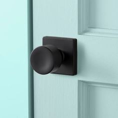 a black door handle on a blue door