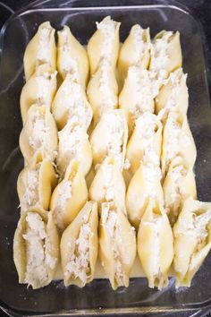 some dumplings are sitting in a plastic container