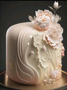 a large white cake with flowers on it