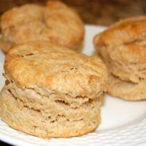 three biscuits stacked on top of each other on a white plate