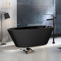 a black bathtub sitting on top of a white floor next to a lamp and window