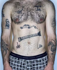 a man with many tattoos on his chest