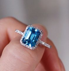 100% Natural Swiss Blue Topaz & Moissanite Ring, shape Rectangle, Size 7x5 MM, 925 sterling silver, 18 K, 14 K, White gold, 18K, 14K, Rose gold, 18 K, 14 K, Yellow gold, Stone  :- Natural Swiss Blue Topaz & Moissanite Shape  :-  Rectangle Size   :-   7x5 MM Secondary stone :- Moissanite Material,  :- 925 sterling silver ❁❁ 𝐉𝐞𝐰𝐞𝐥𝐫𝐲 𝐂𝐞𝐫𝐭𝐢𝐟𝐢𝐜𝐚𝐭𝐞 ❁❁ ↣ KHJewels branded authenticate Jewellery Certificate comes with the authenticity of Metal, Moissanite, and Gemstone combination. ↣ The certificate comes with Limited Lifetime Warranty details. ↣ Listed Jewellery comes with a branded Jewellery Certificate on request. ↣ If you want to get the certificate with your ordered jewellery then please contact me within 72 hours of your order placed. ↣ The certificate is Chargeable. ❃ 𝐒𝐩? Jewelry Certificate, Blue Topaz Jewelry, Blue Topaz Stone, 18k Gold Ring, Zircon Ring, Ring Engagement, Moissanite Ring, Moissanite Rings, Ring Wedding