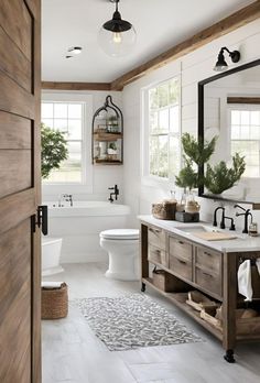 a bathroom with white walls and wood floors