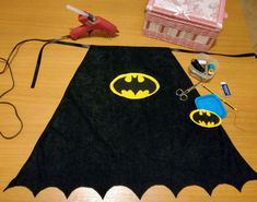 the bat rug is being worked on by someone who has made it look like batman