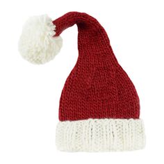 a red and white knitted hat with a pom - pom on top