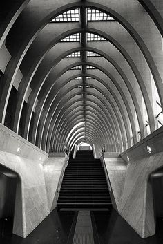 an escalator leading up to the top of a building