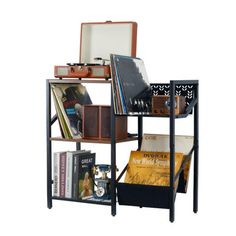 a book shelf filled with books and suitcases on top of each other next to a mirror