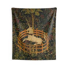 a tapestry with an image of a unicorn on it's back and trees in the background