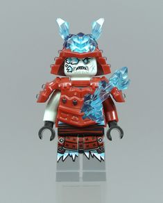 a red and blue lego figure with horns on it's head, holding an ice blade