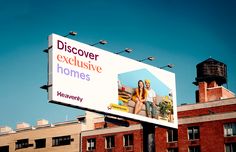 a large billboard on the side of a building advertising homeownership and an image of a man and woman