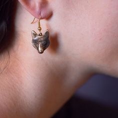 "These pretty wild wolf earrings are meant to reflect the beauty of this animal. And to me, they are certainly beautiful. That's why I designed an entire wolf set in bronze. I think this metal gives them such a warm, rich look. Each earring wolf design is approximately ¾\" by ½.\" The earrings are lovely with either one of the pendants, which can also be ordered here on etsy. Your bronze earrings come on bronze ear wires. These ear wires are nonreactive for most people. Your earrings will come i Wolf Accessories Jewelry, Silver Wolf Design Symbolic Jewelry, Wolf Earrings, Wolf Totem Necklace, Wolf Jewelry, Wild Wolf, Wolf Design, Sterling Silver Charm Bracelet, Bronze Earrings