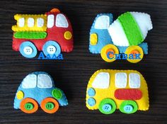 three decorated cookies sitting on top of a table