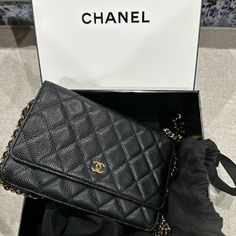 This Is An Authentic Chanel Wallet On Chain (Woc). It Is Crafted From Black Caviar Leather With Gold Hardware. It Has A Leather Chain Threaded Shoulder/Crossbody Strap That Hits Below The Waist. Black Caviar Leather Gold Tone Hardware Interlocking Cc Logo Grosgrain Lining With Card Slots Snap Closure At Front Date: 2013-2014 Made In Italy 7.5"W X 5"H X 1.5"D Shoulder Strap Drop: 18" Condition: Great; Minor Wear On Corner And Trim; Scratches Luxury Wallet On Chain Clutch For Travel, Luxury Clutch Wallet On Chain For Travel, Luxury Travel Wallet On Chain Clutch, Luxury Travel Wallet On Chain Shaped As Clutch, Luxury Travel Wallet With Chain Strap, Luxury Travel Wallet On Chain, Luxury Business Wallet On Chain With Chain Strap, Luxury Crossbody Wallet On Chain For Formal Occasions, Luxury Rectangular Wallet On Chain For Business