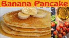 there are pancakes with bananas and tomatoes on the side