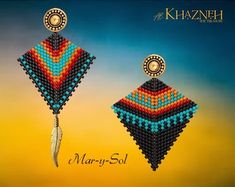 an advertisement for the khazanh jewelry company, featuring two colorful earrings and a feather