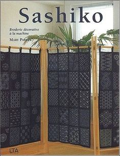 the book cover shows two black screens with designs on them, and one has a plant in it