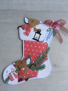 a christmas stocking ornament is shown on the floor