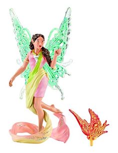 a figurine of a fairy with wings on her back and legs, standing next to a flower