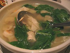 a white bowl filled with soup on top of a table