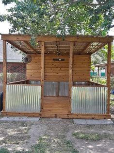 a wooden structure with metal bars on the sides