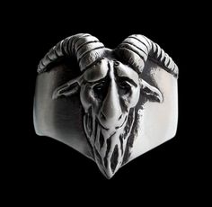 Taking inspiration from Eliphas Levi's Baphomet . It's 100% Sterling Silver carved ring (unisex) Height: 21.5 mm Width: 23 mm (Depending on size) Approx Weight: 17 grams (Depending on size) The ugly beast's head expresses the horror of the sinner, whose materially acting, solely responsible part has to bear the punishment exclusively; because the soul is insensitive according to its nature and can only suffer when it materializes. You can choose 2 types of finishes: shiny or brushed ALL SIZES AV Red Garnet Ring, Carved Ring, Garnet Rings, Red Garnet, Ring Sterling Silver, Sterling Ring, Small Businesses, Band Rings, Goats