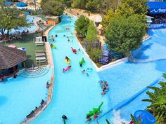 an aerial view of a water park with people playing in it