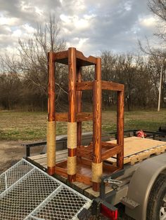 a wooden structure sitting on the back of a truck