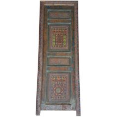 an old wooden door with decorative designs on it